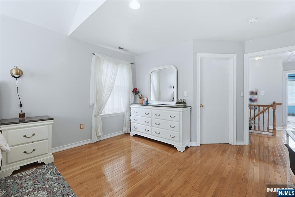 39 Voorhees Street Teaneck, NJ 07666 - Photo 28 of 47 a room with a dresser and a mirror