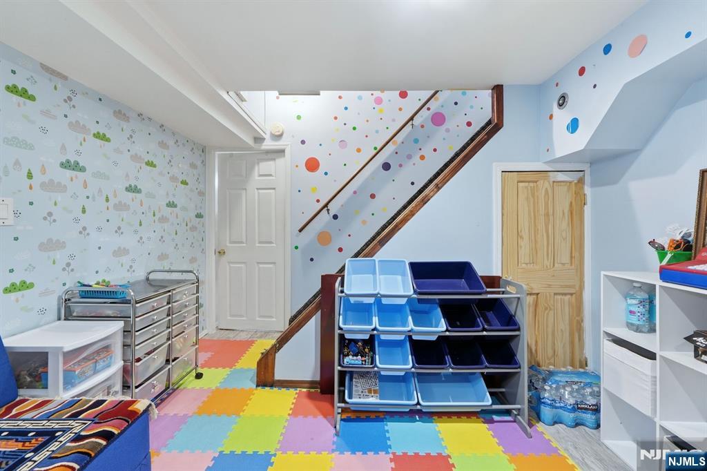 39 Voorhees Street Teaneck, NJ 07666 - Photo 39 of 47 a room with lots of furniture and clutter