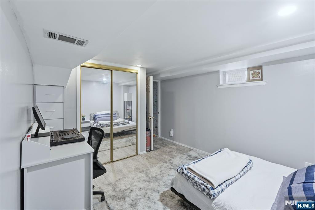 39 Voorhees Street Teaneck, NJ 07666 - Photo 45 of 47 a view of a workspace with furniture and a window