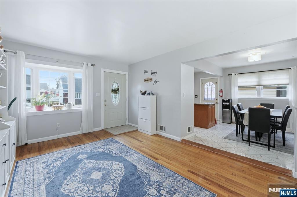 39 Voorhees Street Teaneck, NJ 07666 - Photo 7 of 47 a view of a livingroom with furniture and wooden floor