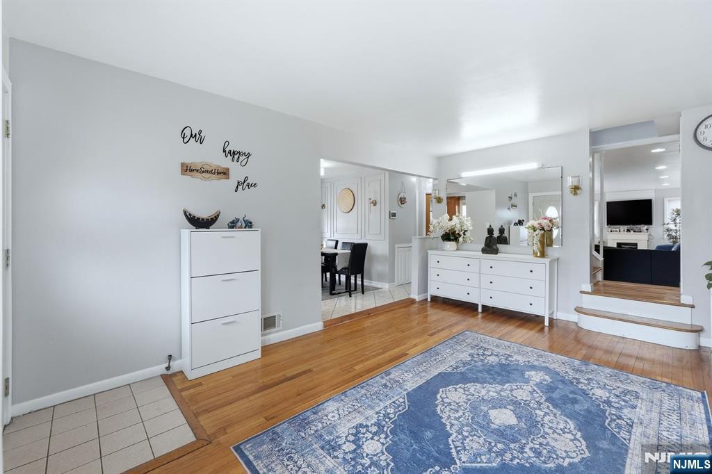 39 Voorhees Street Teaneck, NJ 07666 - Photo 8 of 47 a large white bed in a white room