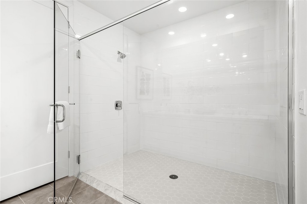 3604 Rivington Irvine, CA 92612 - Photo 21 of 54 a bathroom with a shower and a glass window