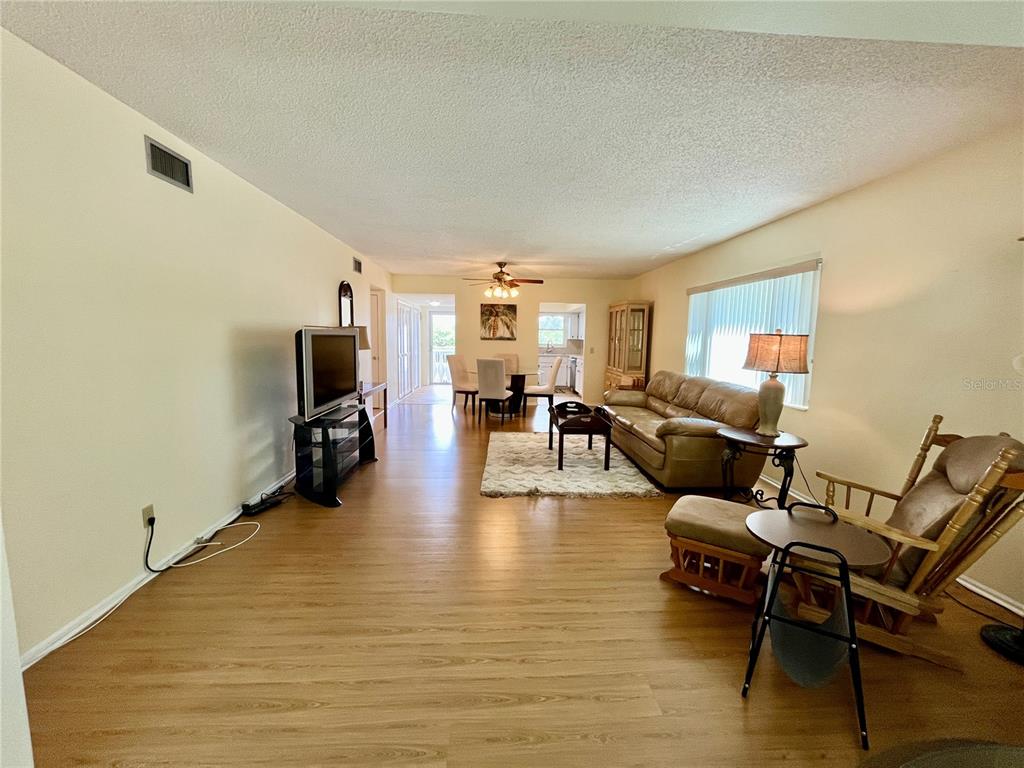 2292 Costa Rican Drive, Unit 22 Clearwater, FL 33763 - Photo 14 of 44 a living room with furniture and a flat screen tv