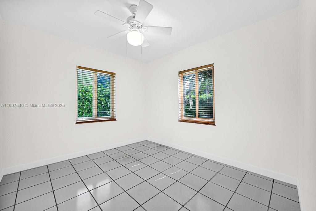 5960 Southwest 47th Street, Unit 1 Miami, FL 33155 - Photo 11 of 39 a view of an empty room with window