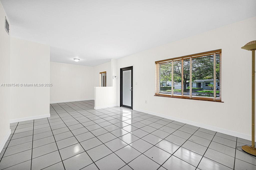 5960 Southwest 47th Street, Unit 1 Miami, FL 33155 - Photo 12 of 39 a view of a livingroom with an entryway