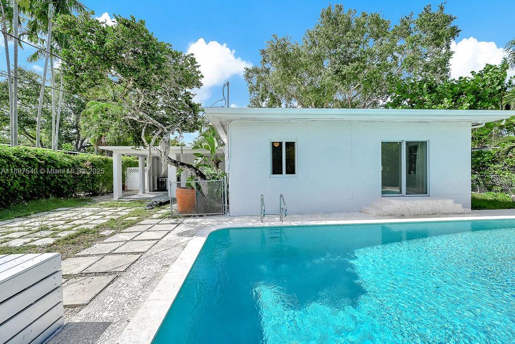 5960 Southwest 47th Street, Unit 1 Miami, FL 33155 - Photo 20 of 39 a front view of a house with a yard