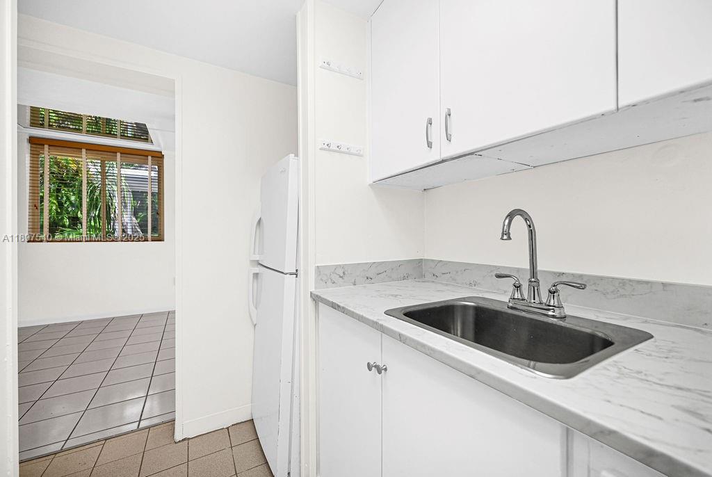 5960 Southwest 47th Street, Unit 1 Miami, FL 33155 - Photo 29 of 39 a close view of a sink and dishwasher in a kitchen