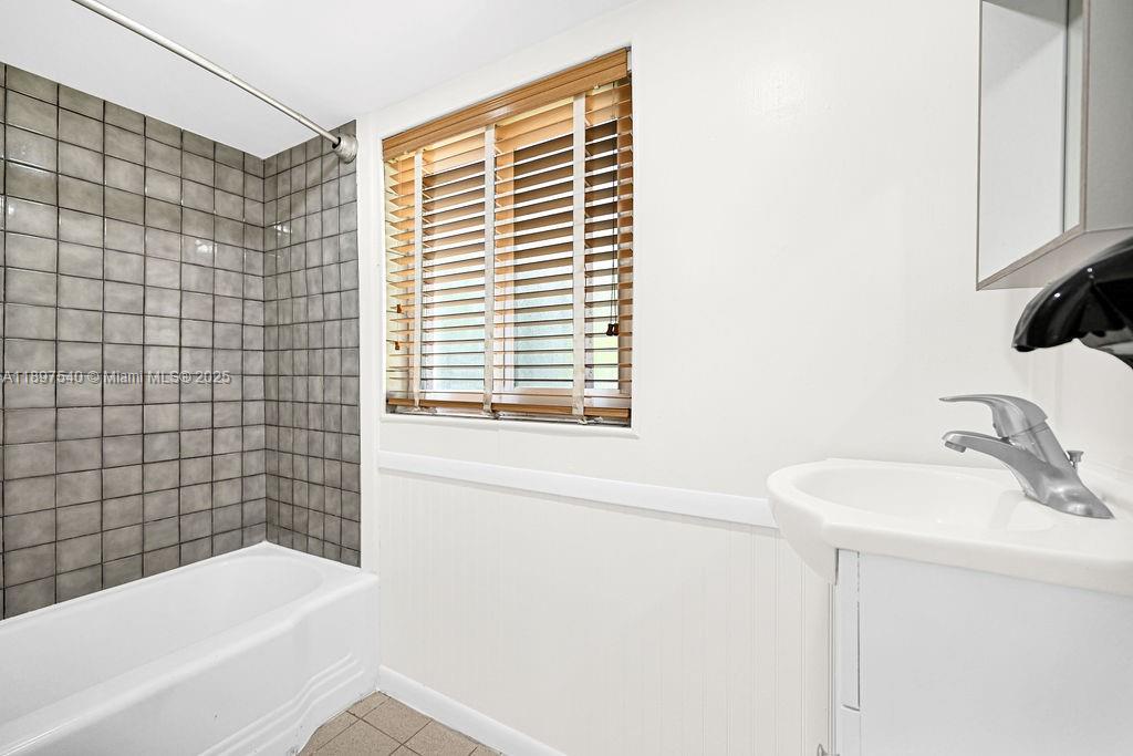 5960 Southwest 47th Street, Unit 1 Miami, FL 33155 - Photo 30 of 39 a bathroom with a sink and a bathtub