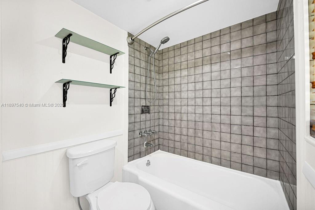 5960 Southwest 47th Street, Unit 1 Miami, FL 33155 - Photo 31 of 39 a bathroom with a toilet and a shower