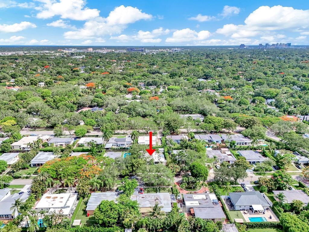 5960 Southwest 47th Street, Unit 1 Miami, FL 33155 - Photo 36 of 39 an aerial view of residential houses with outdoor space and trees