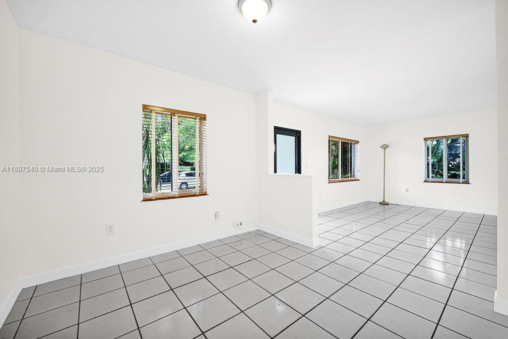 5960 Southwest 47th Street, Unit 1 Miami, FL 33155 - Photo 5 of 39 a view of an empty room with window