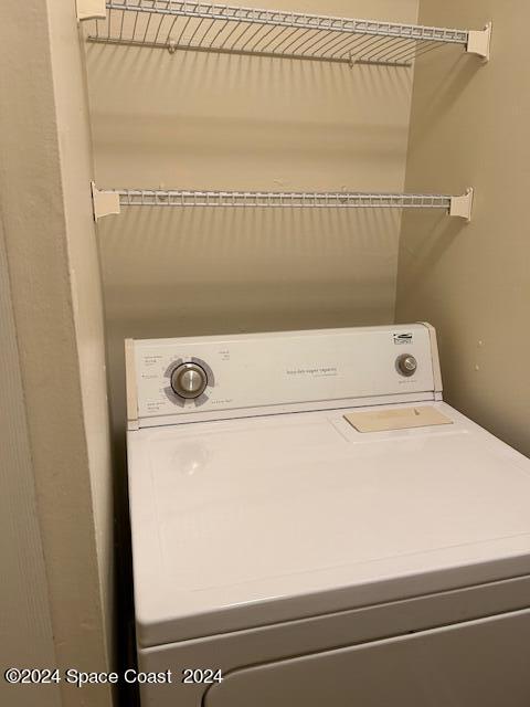 7667 North Wickham Road, Unit 710 Melbourne, FL 32940 - Photo 13 of 23 a utility room with dryer and washer