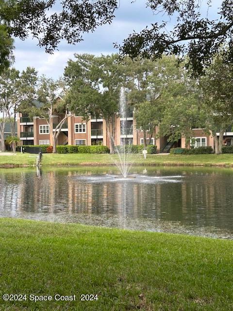 7667 North Wickham Road, Unit 710 Melbourne, FL 32940 - Photo 16 of 23 a view of residential house with outdoor space and lake