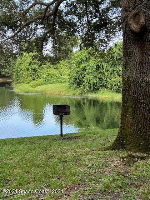 7667 North Wickham Road, Unit 710 Melbourne, FL 32940 - Photo 17 of 23 a view of a lake from a yard