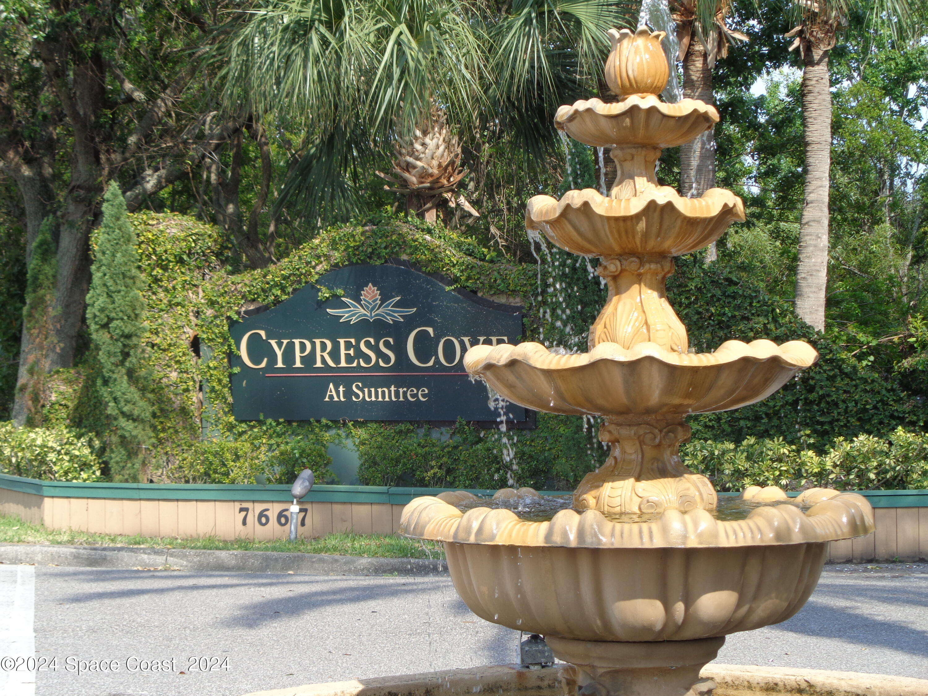 7667 North Wickham Road, Unit 710 Melbourne, FL 32940 - Photo 18 of 23 a view of a fountain in the patio with a fountain
