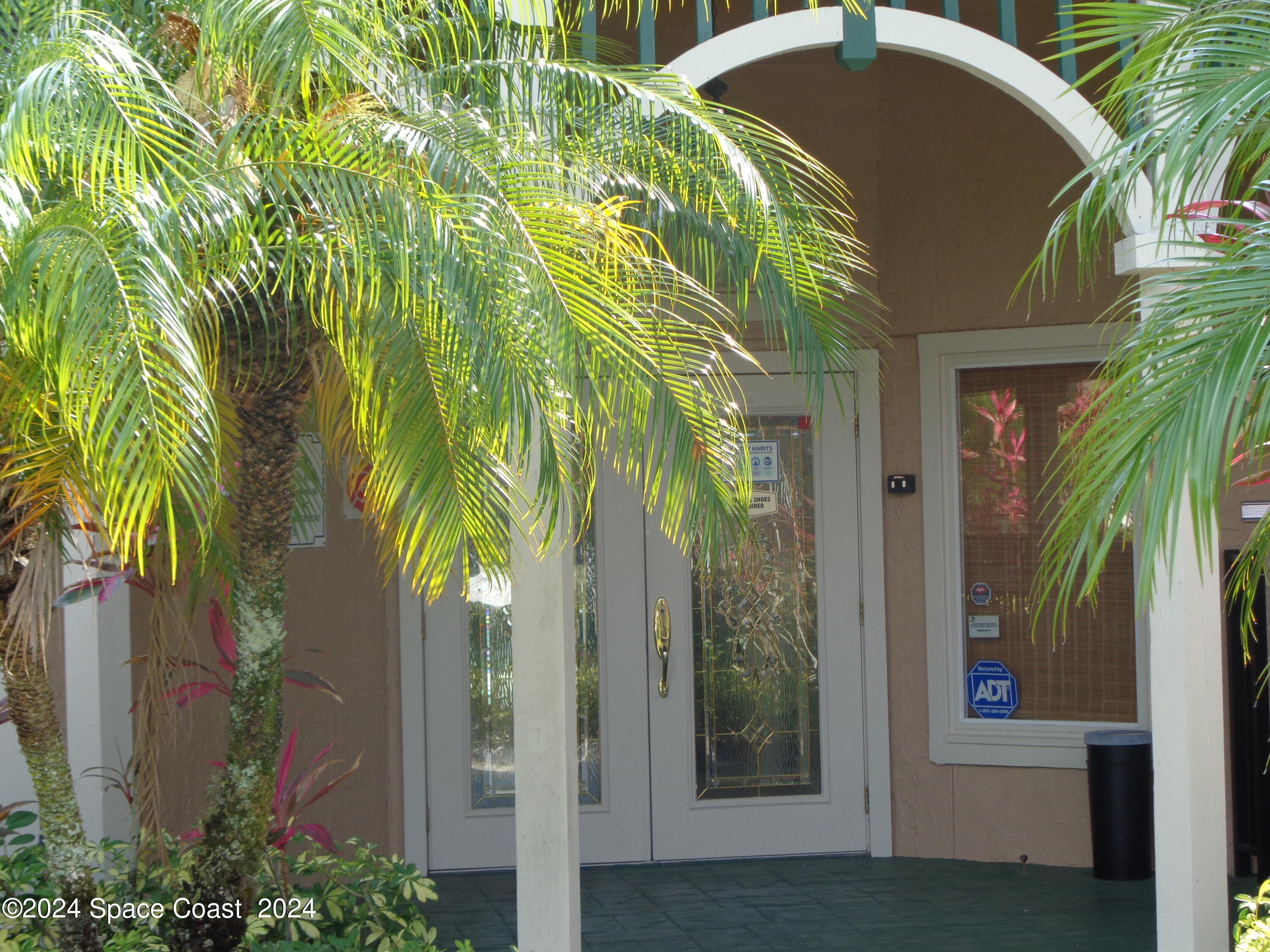 7667 North Wickham Road, Unit 710 Melbourne, FL 32940 - Photo 19 of 23 a view of a garden