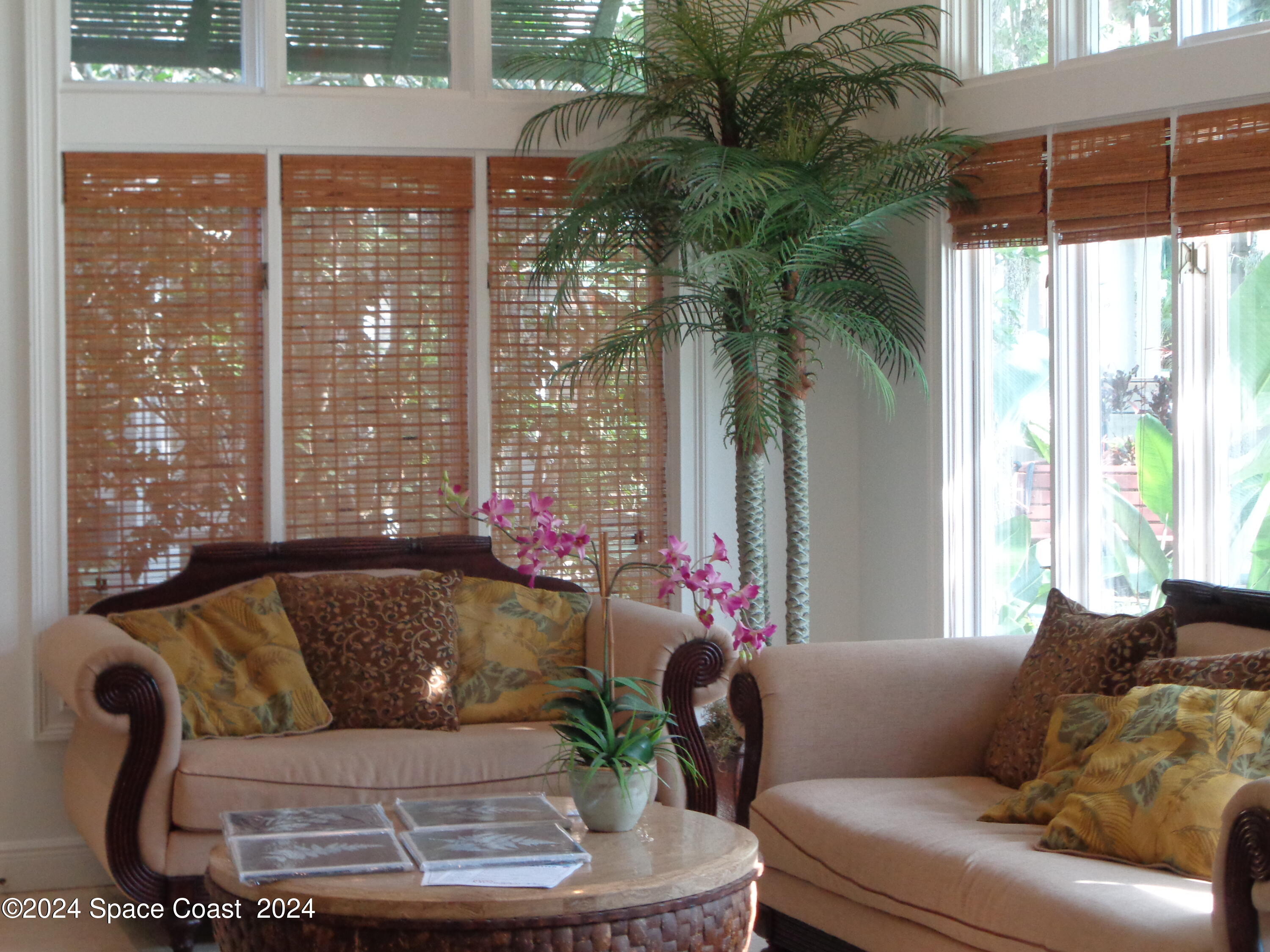 7667 North Wickham Road, Unit 710 Melbourne, FL 32940 - Photo 21 of 23 a living room with furniture and a large window