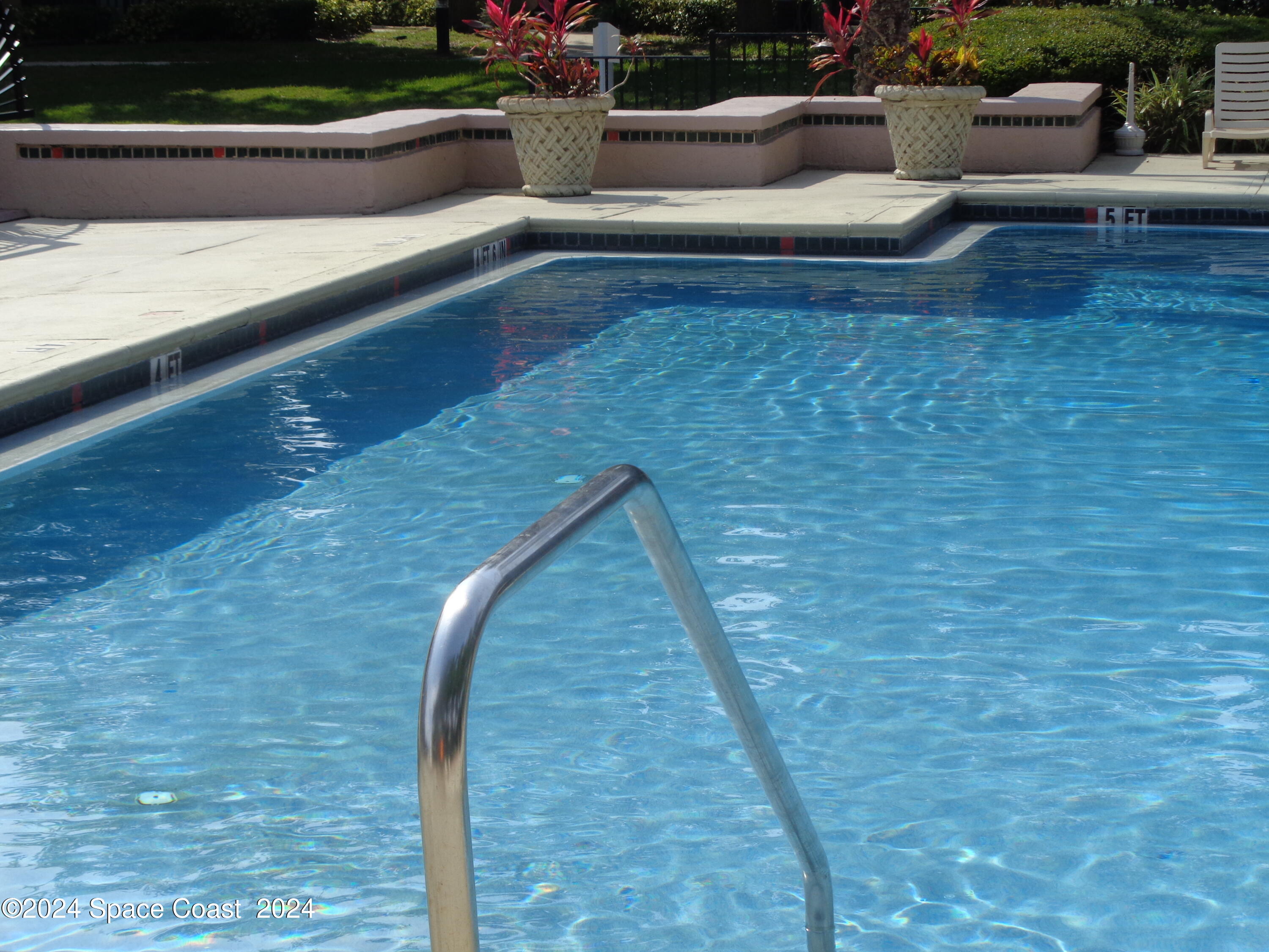 7667 North Wickham Road, Unit 710 Melbourne, FL 32940 - Photo 22 of 23 a view of swimming pool with seating space