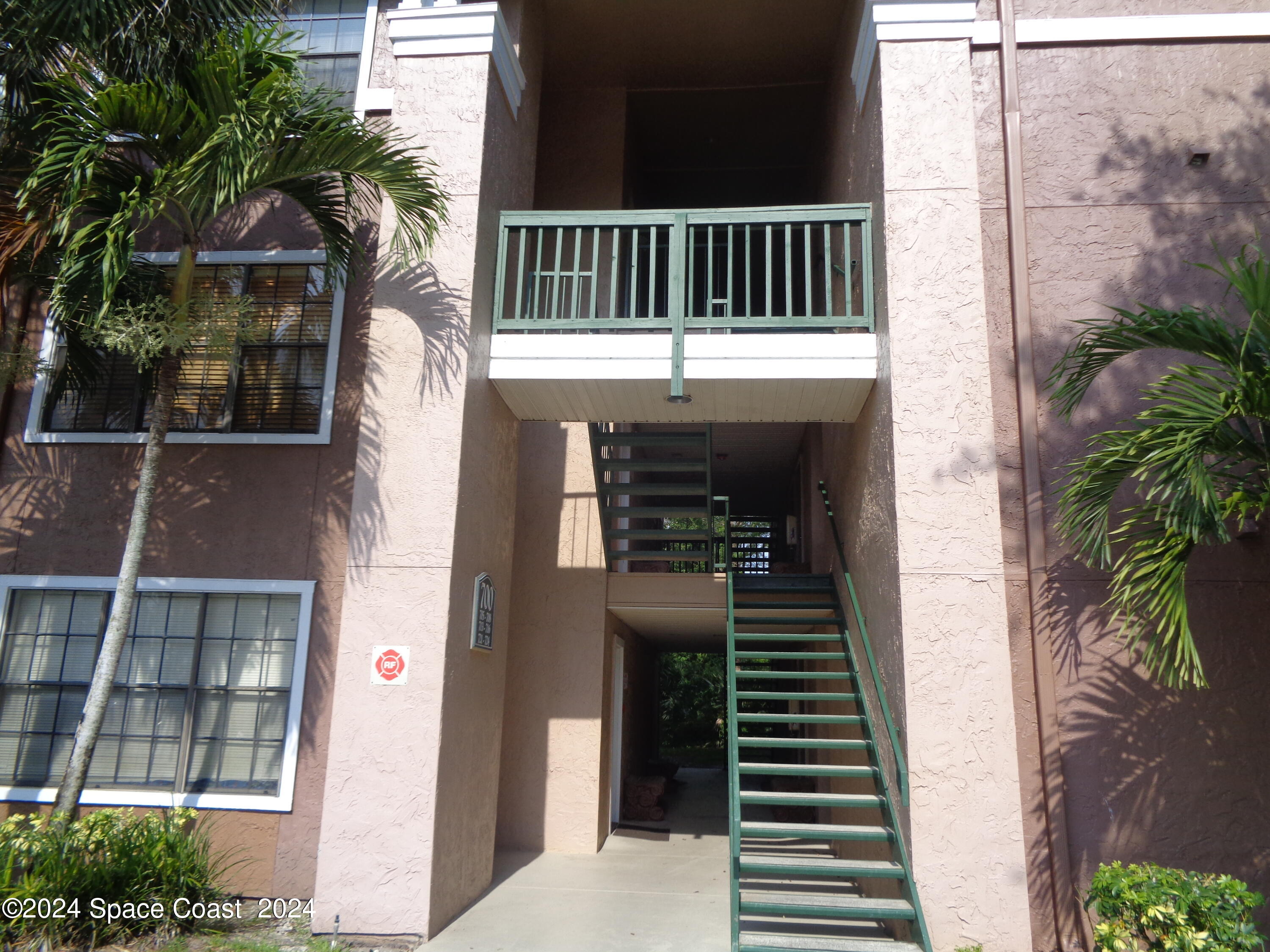 7667 North Wickham Road, Unit 710 Melbourne, FL 32940 - Photo 3 of 23 a view of a house with a deck