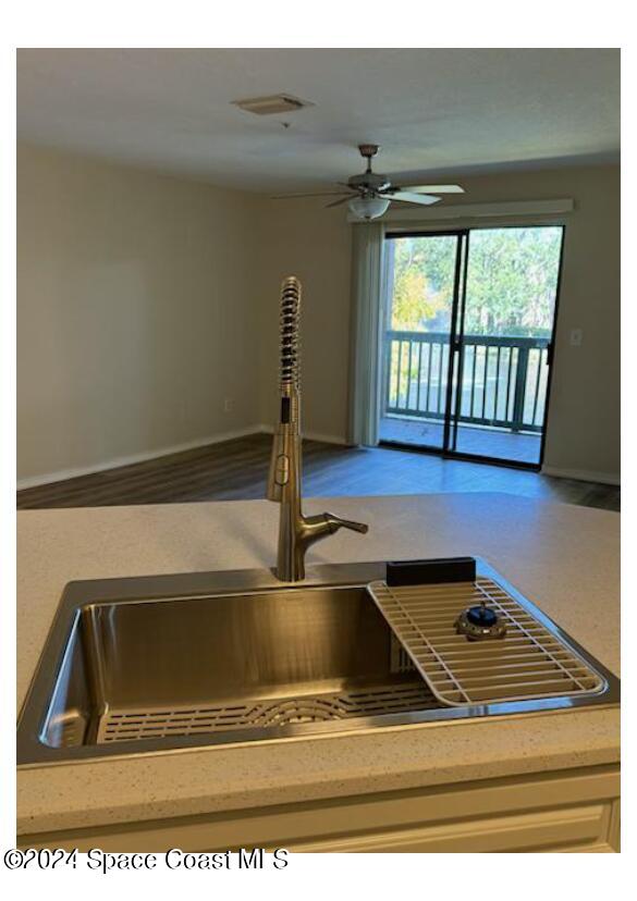 7667 North Wickham Road, Unit 710 Melbourne, FL 32940 - Photo 6 of 23 a view of water heater room with wooden floor