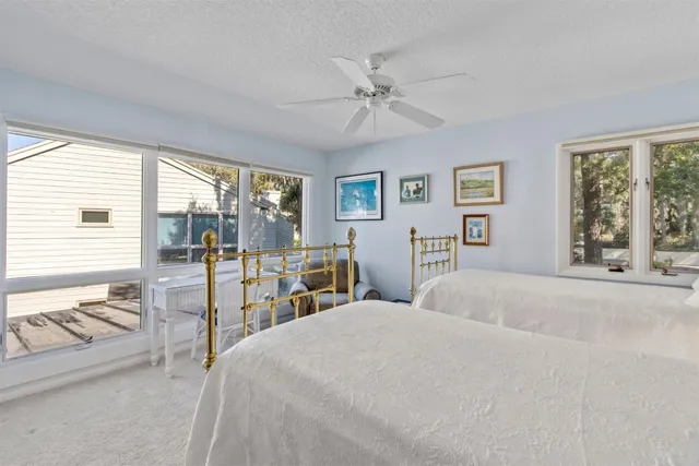 a bedroom with a large bed and a large window