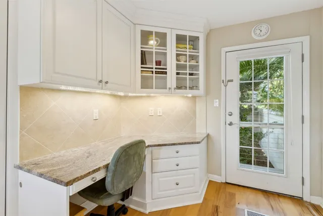 a room with chair and window