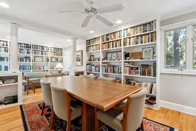 a view of a dining room with furniture window and wooden floor