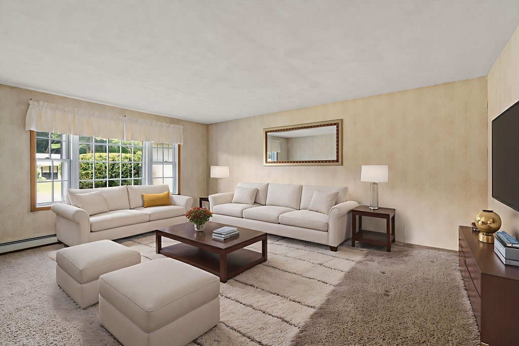16 Larnis Road Framingham, MA 01701 - Photo 3 of 17 a living room with furniture and a flat screen tv