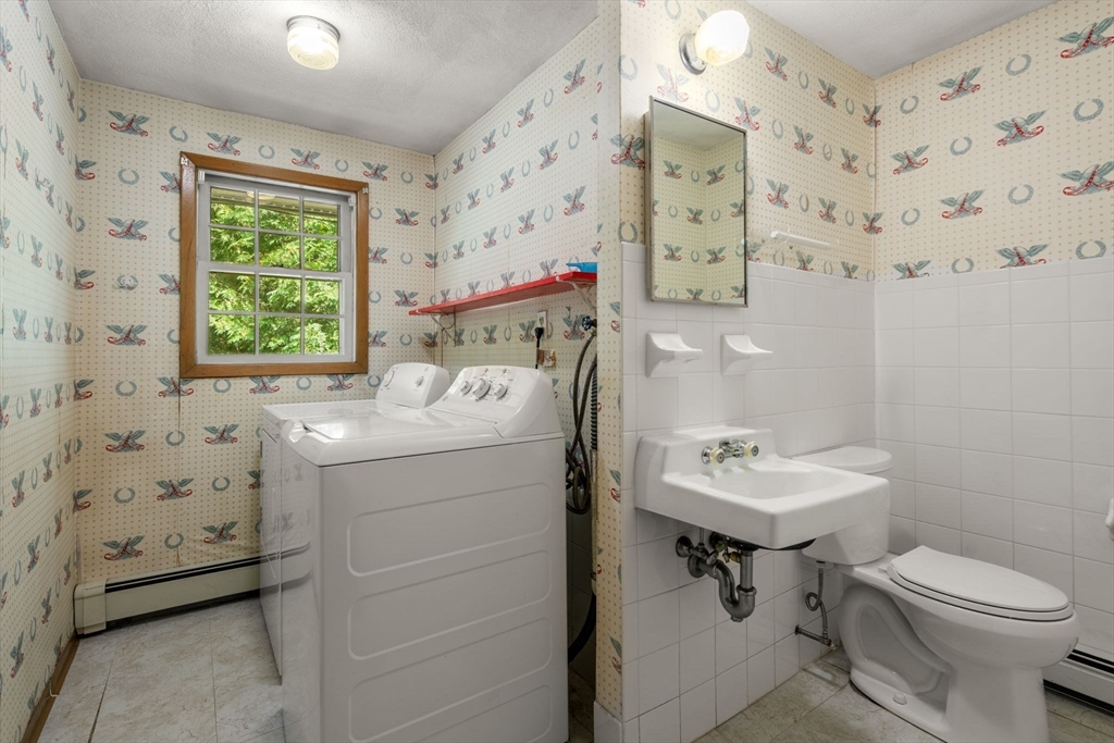 16 Larnis Road Framingham, MA 01701 - Photo 8 of 17 a bathroom with a sink toilet and window