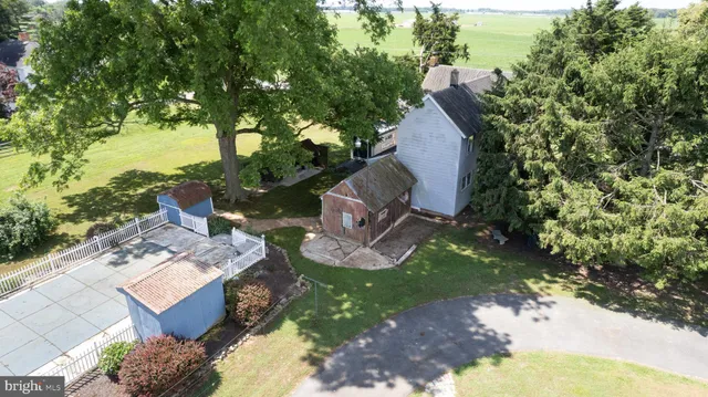 an aerial view of lake and residential houses with outdoor space
