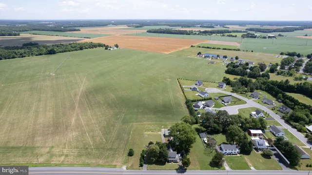 a living room with furniture fireplace and a large window