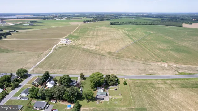 a bedroom with a bed and a television