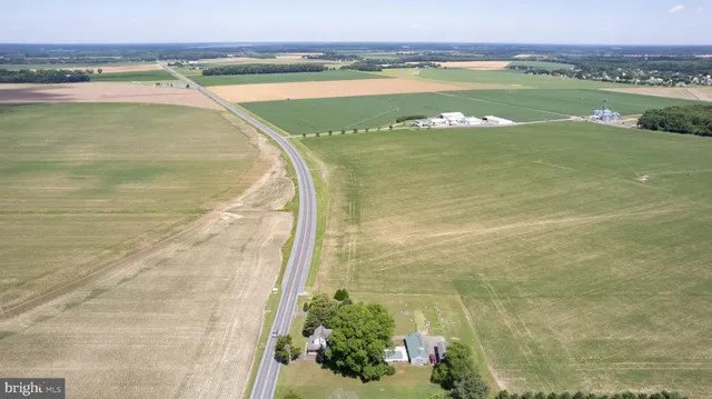a view of a livingroom with furniture and workspace