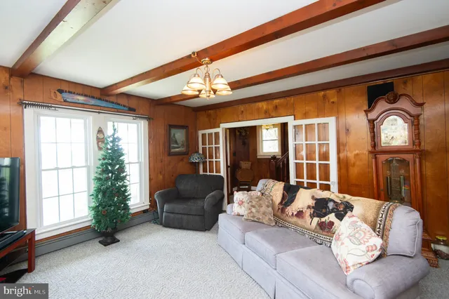 a bathroom with a sink a toilet and shower curtain