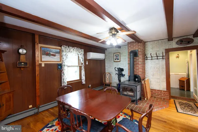 a bedroom with a bed and a television