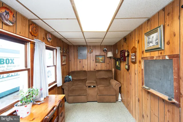a bathroom with a sink a toilet and a large mirror