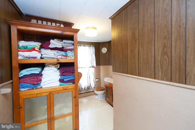 a view of a patio with table and chairs and potted plants