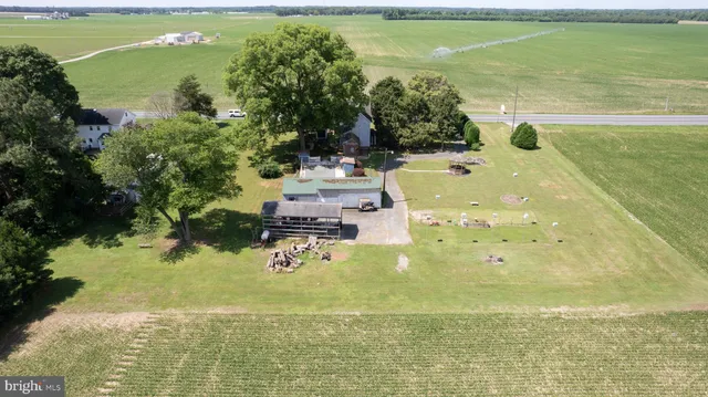 an aerial view of a house with a ocean view