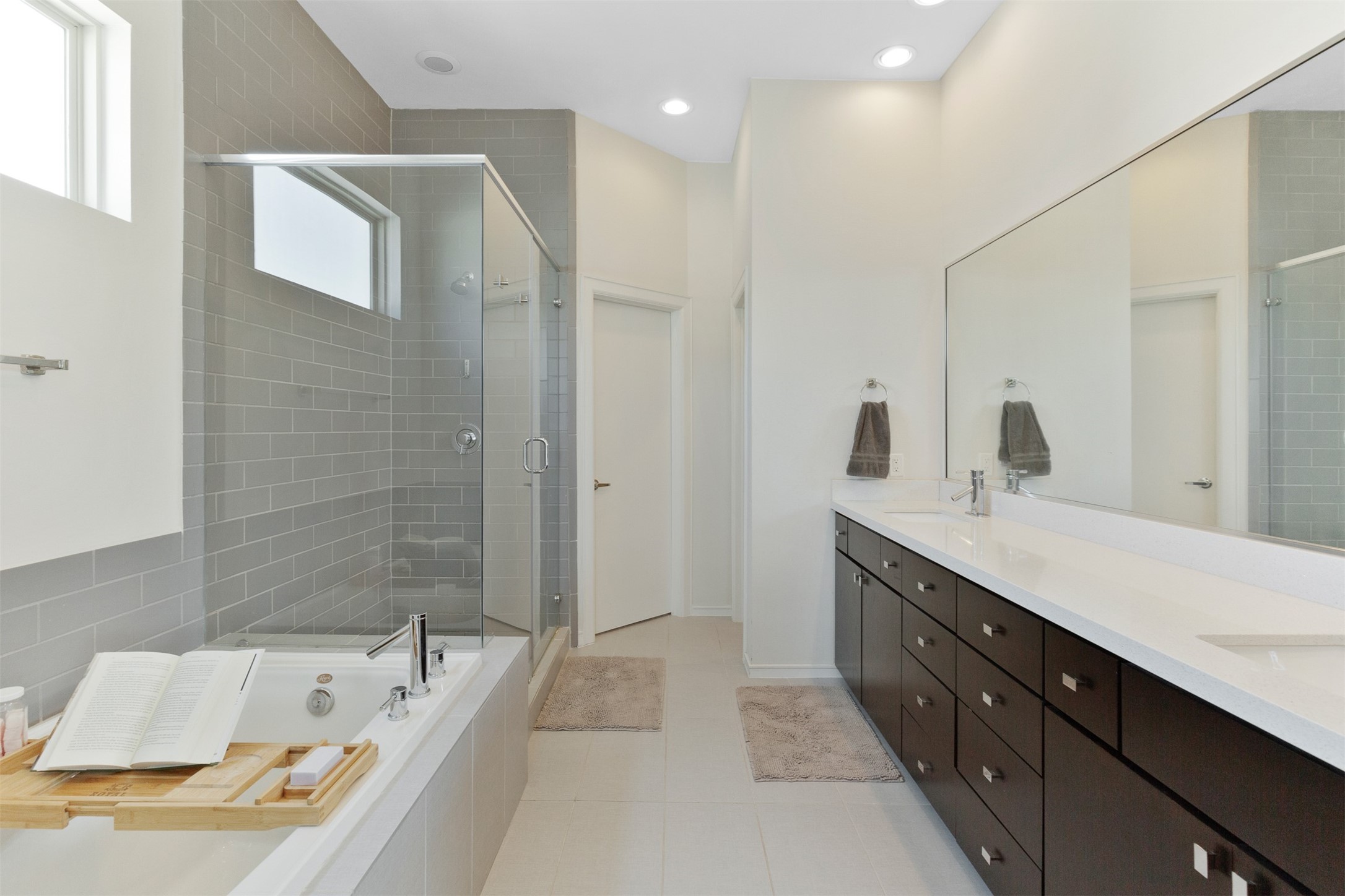 1308 Delano Street Houston, TX 77003 - Photo 15 of 24 a spacious bathroom with a tub sink and mirror