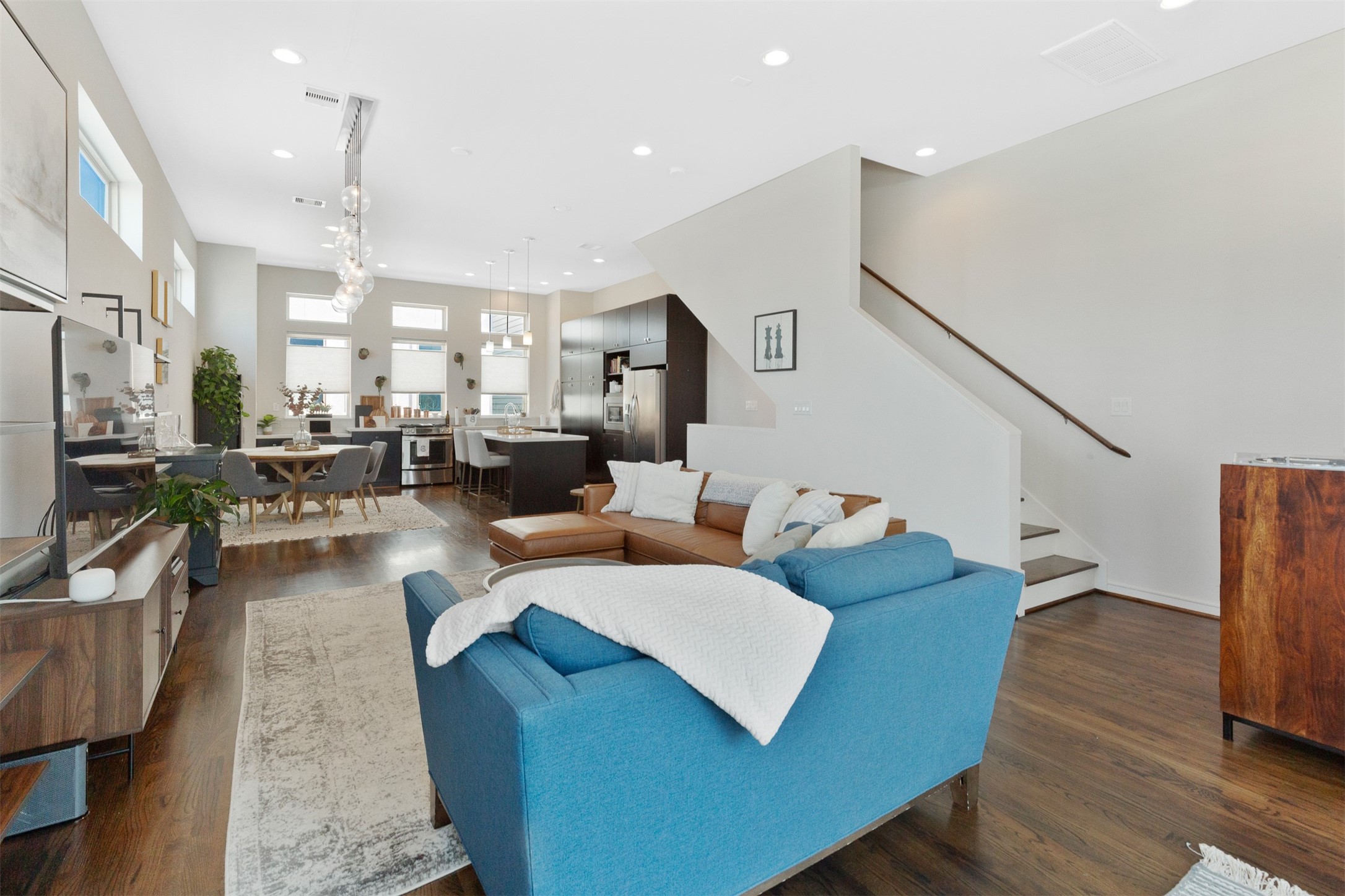 1308 Delano Street Houston, TX 77003 - Photo 6 of 24 a living room with furniture kitchen view and a wooden floor