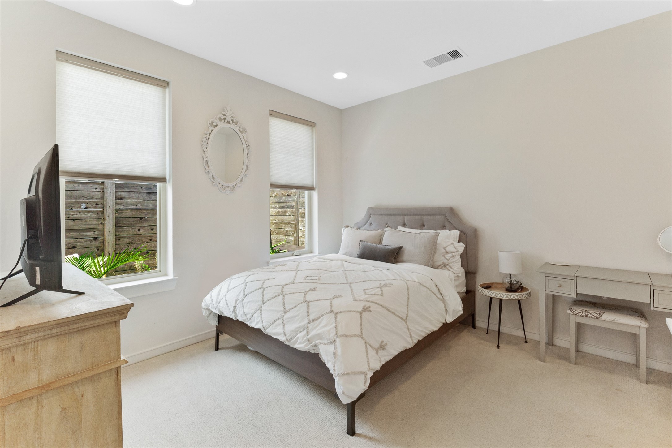 1308 Delano Street Houston, TX 77003 - Photo 9 of 24 a bedroom with a bed and a couch