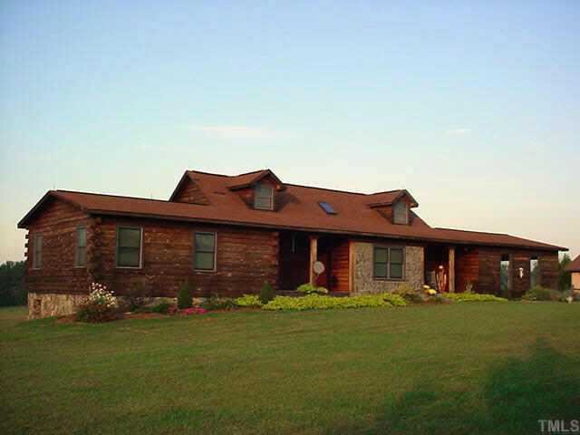 696 Johnson Town Road Zebulon, NC 27597 - Photo 1 of 1 a front view of a house with garden