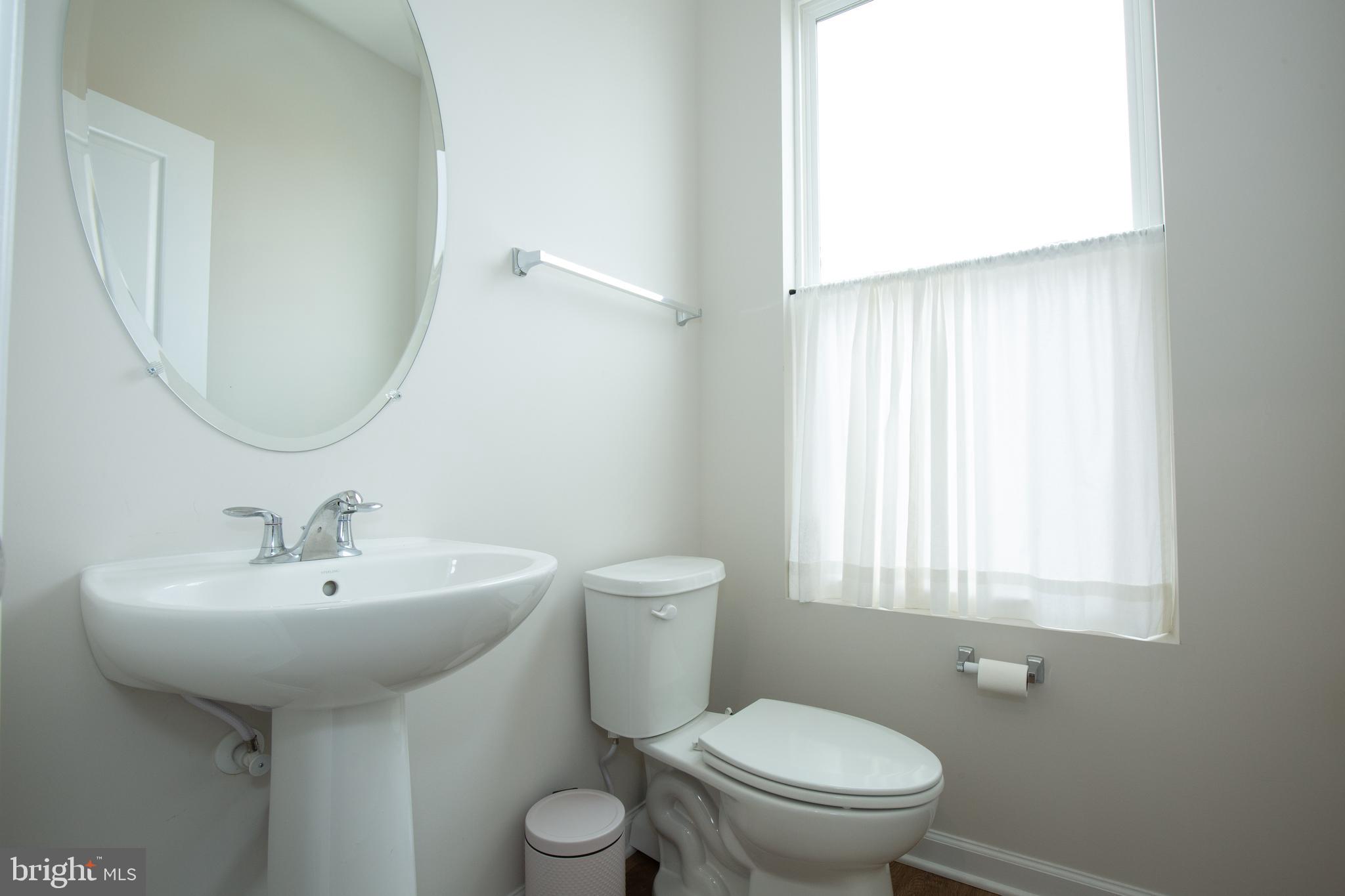80 Anthem Street Ranson, WV 25438 - Photo 15 of 30 a bathroom with a toilet a sink and a window
