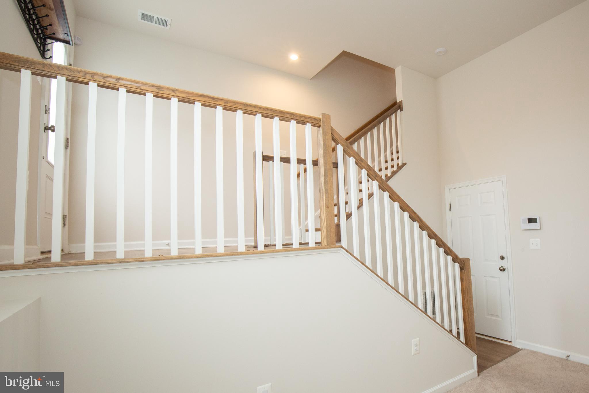 80 Anthem Street Ranson, WV 25438 - Photo 24 of 30 a view of a hallway with staircase