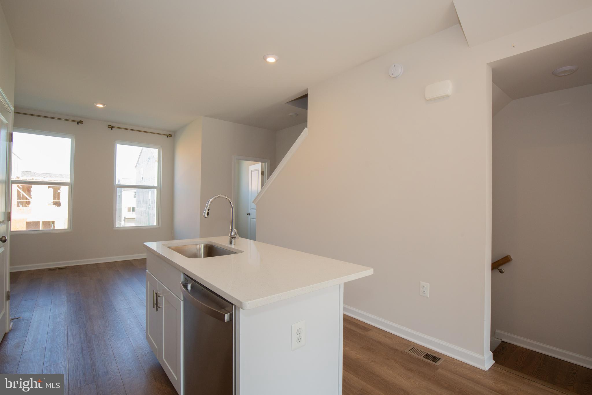 80 Anthem Street Ranson, WV 25438 - Photo 4 of 30 a kitchen with a sink cabinets and wooden floor
