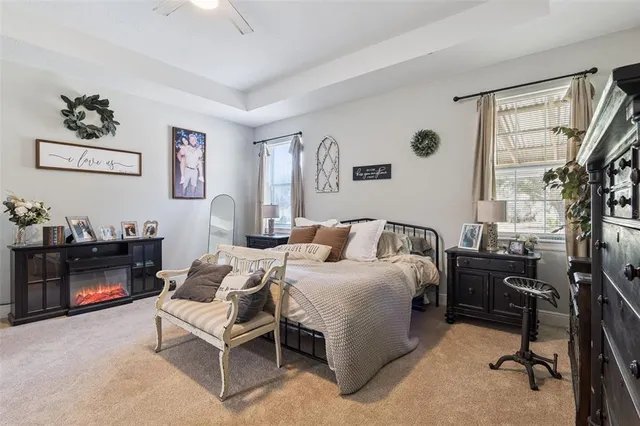 a bed room with a bed and a chair