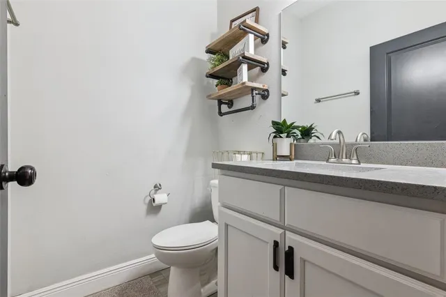 a bathroom with a sink and toilet