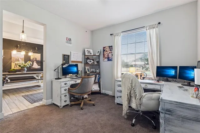 a workspace with furniture and a window