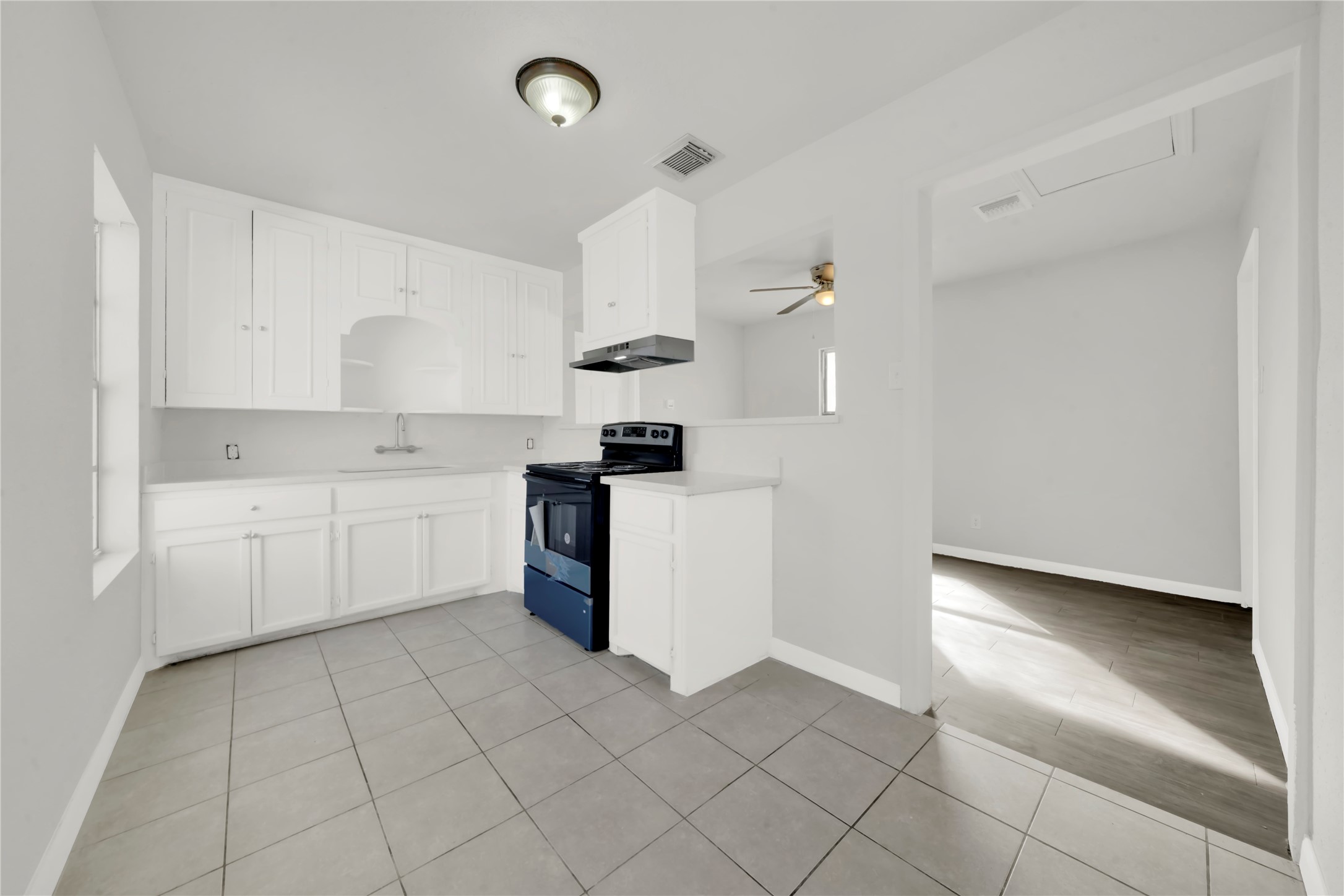 106 Hanover Street Houston, TX 77012 - Photo 41 of 49 a kitchen with cabinets and window