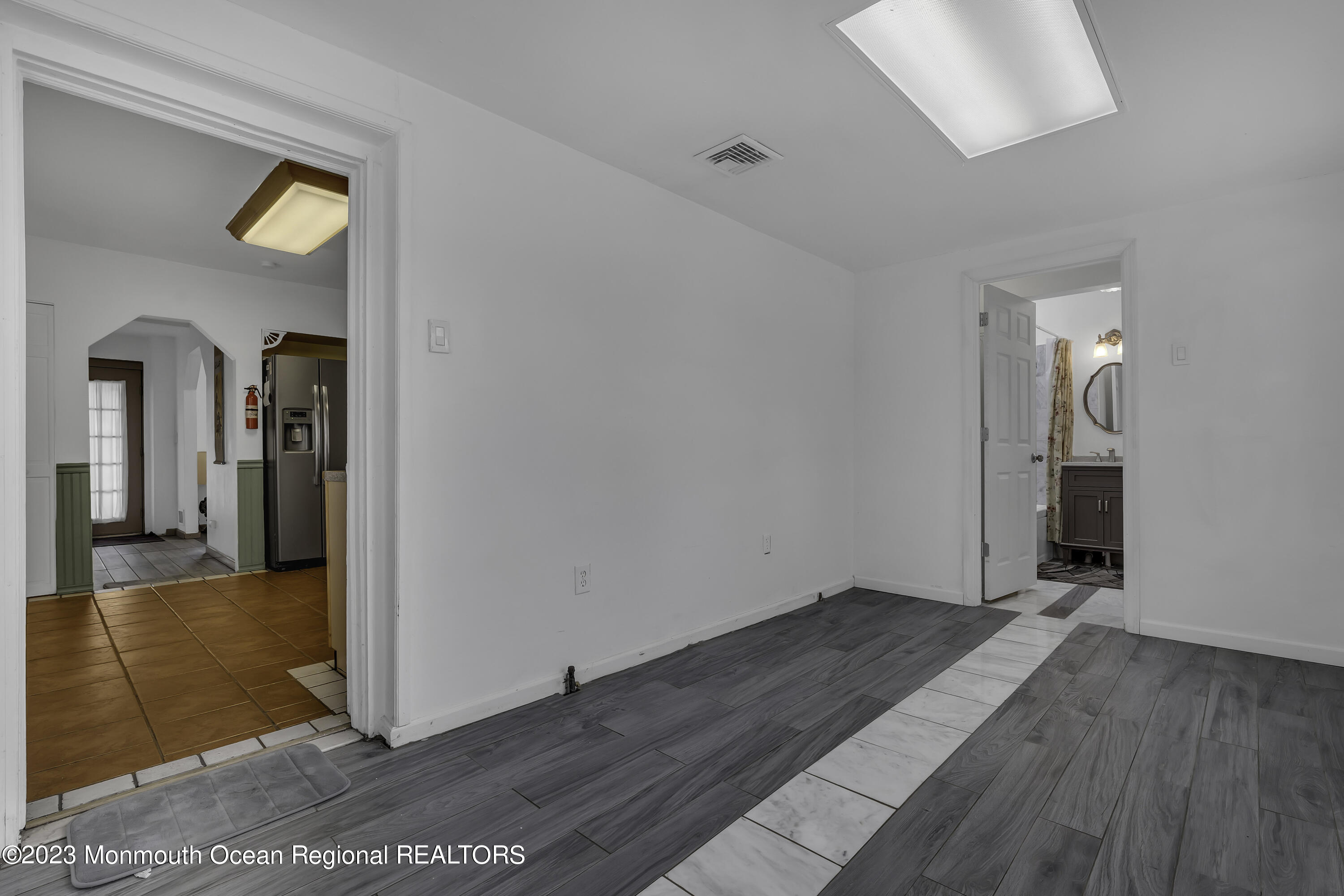 237 Broadway Union Beach, NJ 07735 - Photo 11 of 23 wooden floor in an empty room